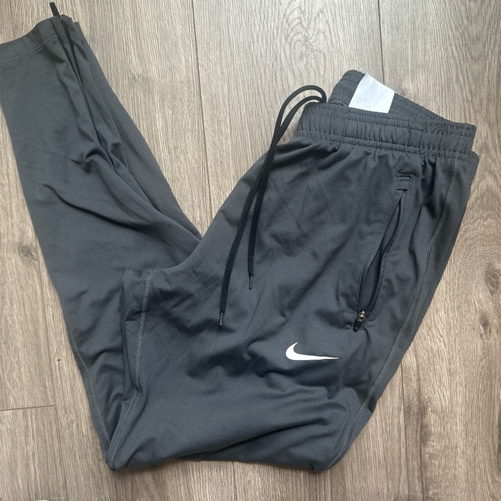 Nike Dri Fit Women's Charcoal Track Joggers with White Swoosh - Picture 3 of 13